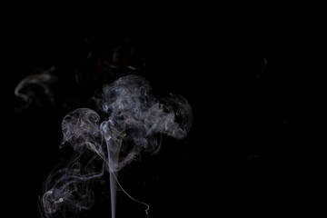 White clouds of smoke with copy space on black background