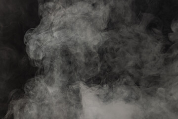 White clouds of smoke with copy space on black background