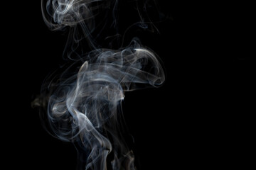 White clouds of smoke with copy space on black background