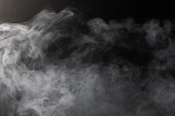 White clouds of smoke with copy space on black background