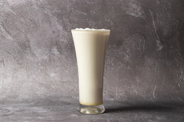 Vanilla Milkshake or lassi and milk served in glass isolated on background top view of bangladesh...