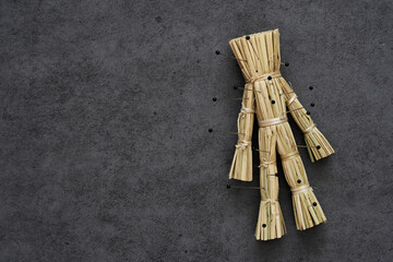 halloween curse straw doll Japanese wara ningyo voodoo dark magic background. halloween curse straw doll Japanese wara ningyo voodoo dark magic dark background. curse straw doll                   