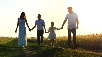 mother father child daughter son walk sunset, holding hands parents girl boy, happy family, wheat field, childhood dream, winner, carefree childhood, family running together park, happy family concept