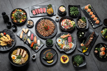 many traditional japanese food dishes variety on grey background - 635744210