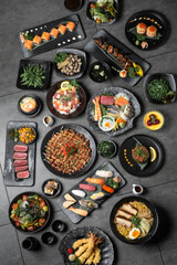 many traditional japanese food dishes variety on grey background - 635744222