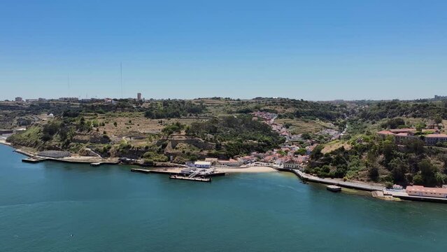 Drone shot reversing oout from Porto brandao by the river Tejo, in Portugal.