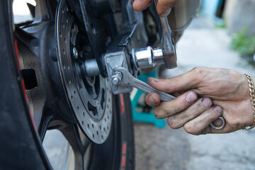 Man repairing motorcycle. Sport. Hobby