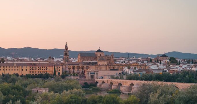 Sunset close upview day to night timelapse of Cordoba  Mezquita Mosque cathedral and roman bridge during summer