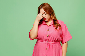 Young sick ill sad chubby overweight redhead woman wear casual clothes pink dress keep eyes closed...