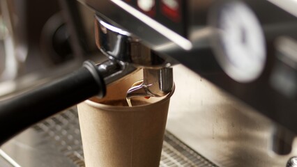 Preparing espresso on a coffee machine in a specialized coffee shop