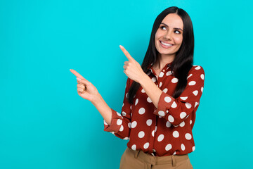 Photo of charming young lady brunette hair looking interested fingers pointing mockup useful...