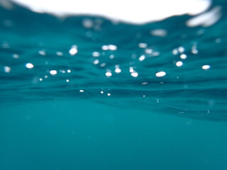 A clear clean turquoise sea water Blackground to use as wallpaper..