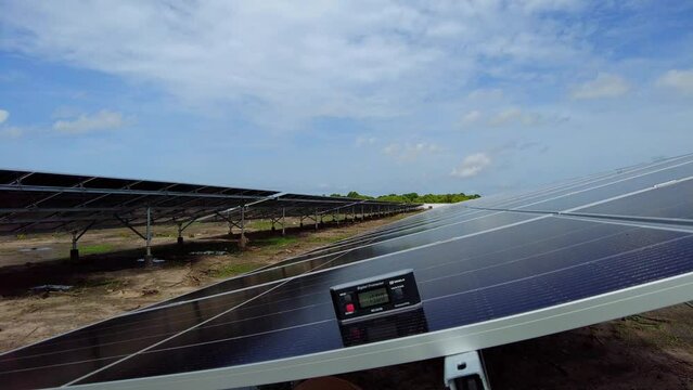 Static shot showing digital protractor with tilt angle measurement inside a renewable energy solar farm in Jambur - Gambia - West Africa