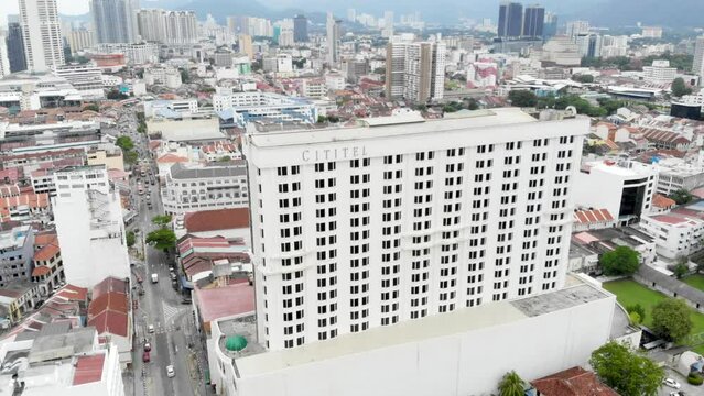 Aerial view of Komtar Buildings and modern Apartments surrounded by greenery in Penang 