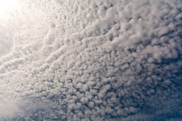 White clouds in the blue sky.