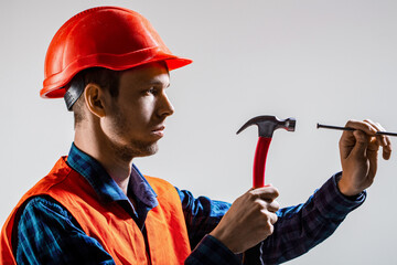 Man builder. Hammer hammering. Builder in helmet, hammer, handyman, builders in hardhat. Hammer...