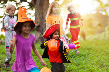 Kids trick or treat. Halloween fun for children.