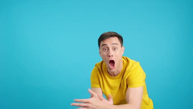Man celebrating while pointing to the side