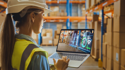 Futuristic Technology Warehouse: Female Worker Doing Inventory, Using Augmented Reality Program On...