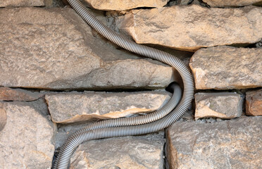 Open electricity cable in an old French building