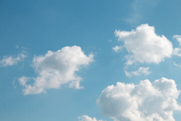 Photo of clear sky with white clouds, natural background