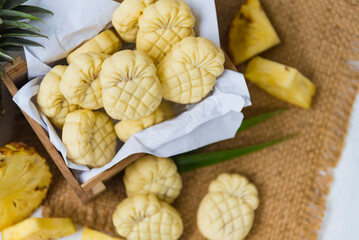 Homemade butter cookies with pineapple jam inside, Photographed with natural light. Selective Focus. White textured background.