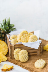 Homemade butter cookies with pineapple jam inside, Photographed with natural light. Selective Focus. White textured background.