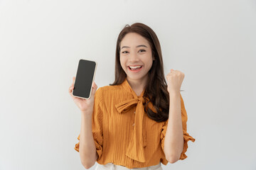 excited young woman play games by mobile phone make winner gesture. female winning mobile gambling....
