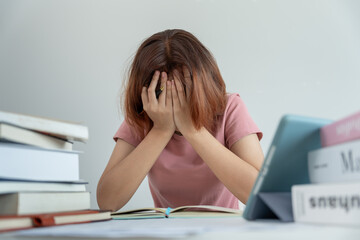 Asian student woman have anxiety because of exams, female prepare for test and learning lessons in the library. stress, despair, haste, misunderstanding reading, discouraged, expectation, knowledge