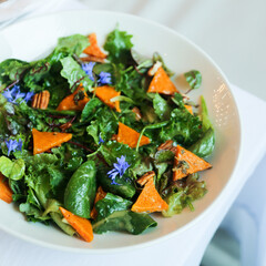 Leaf salad with roasted pumpkin and flowers