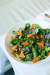 Leaf salad with roasted pumpkin and flowers