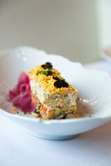 Traditional salmon salad with egg yolks