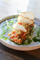 Salmon tartare with avocado and chips