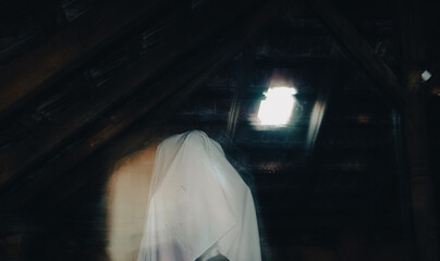 blurred image of ghost in the attic haunted house for Halloween