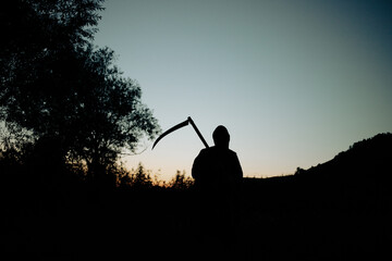 grim reaper, the death itself, scary horror shot of Grim Reaper holding scythe