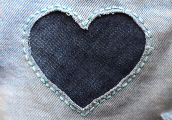 heart shaped patch on jeans background