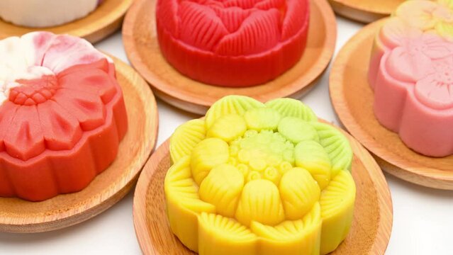 angle view trendy different flower shapes mooncakes rotating at horizontal composition