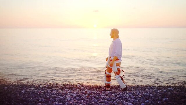 happy man uses exoskeleton technology to walk after injury