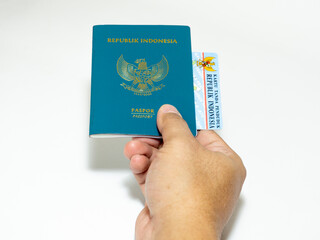 hand holding passport and ID Card