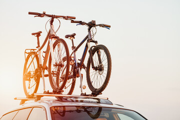 car is transporting bicycles on the roof. roof mount for carrying bikes and baggage. Family car for...