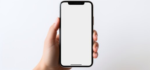 BLANK SCREEN SMARTPHONE MOCKUP, Mock-up, Template, Sample, White background, Hand. Young male hand holding a smartphone in vertical position. Neutral background. Close-up and focus on it, frontal view