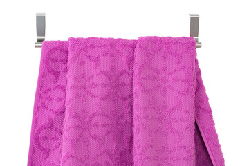 a terry towel hangs on a metal bracket attached to the wall, isolated
