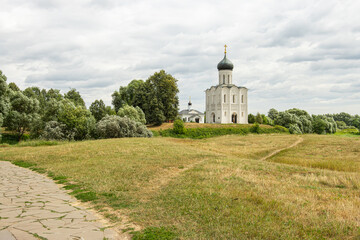 Path in the field leading to the Christian church