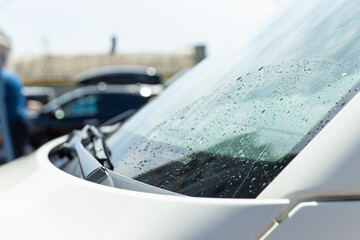 A man washes a car at a self-service car wash