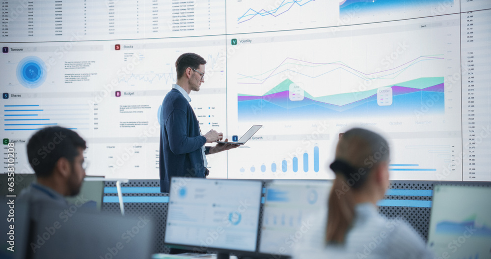 Aufkleber male senior financial analyst reviewing information and reports on big digital screen in modern moni