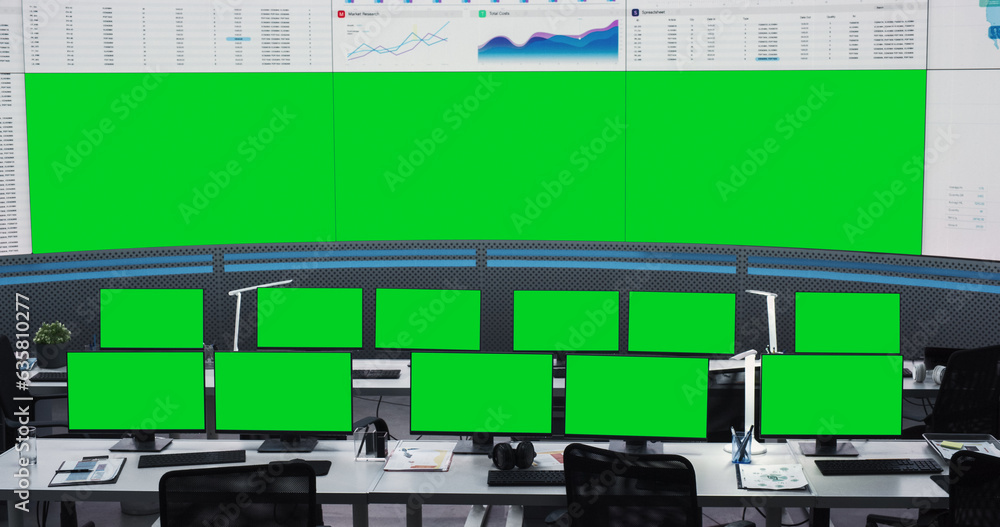 Poster Empty Monitoring Office With Green Screen Chromakey Desktop Computer Monitors Of Employees. Big Digital Screens Showing Graphs And Charts. Mockup Template Of Successful Financial Analytics Company.