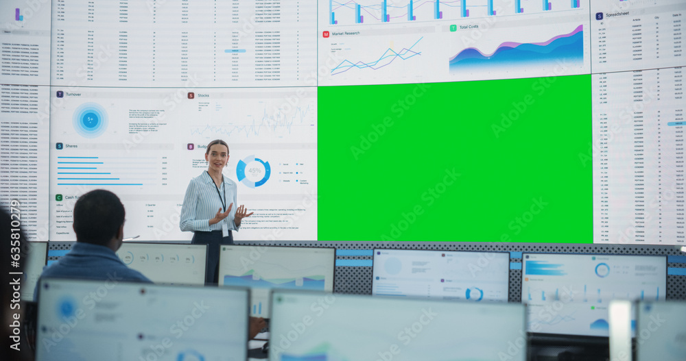 Poster Caucasian Female Data Scientist Giving Presentation On Big Digital Screen With Green Screen Chromakey In Monitoring Office. Team Of Deep Learning Company Employees Listening Behind Desktop Computers.