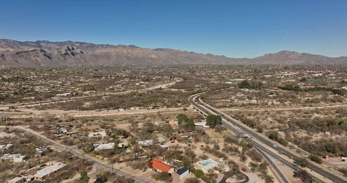 Tucson Arizona Aerial v11 establishing shot drone flyover Woodland Hills area towards Tanque Verde Creek capturing nature landscape of mountainous desert - Shot with Mavic 3 Cine - March 2022