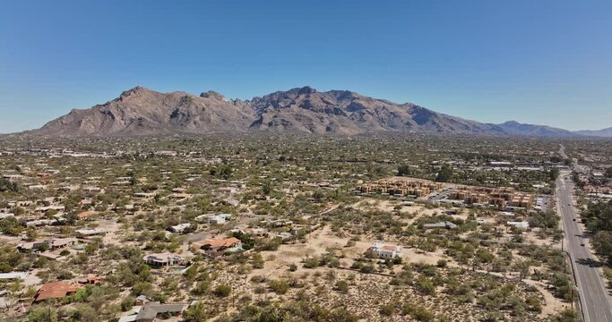 Tucson Arizona Aerial v1 drone flyover Casas Adobes Casas Catalinas neighborhood capturing desert landscape and mountainscape with rocky mountain ridges - Shot with Mavic 3 Cine - March 2022