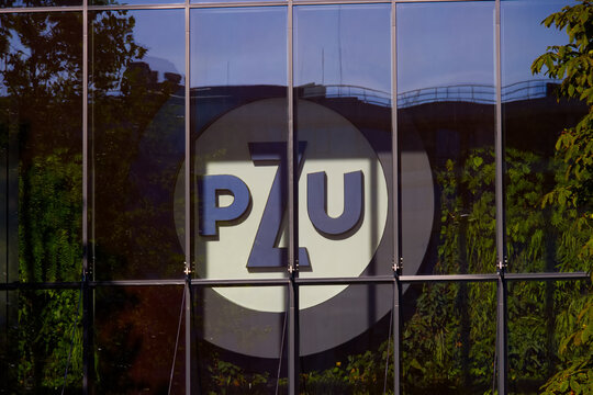 Sign PZU. Company signboard PZU, view through window, Warsaw, Poland. August 17, 2023